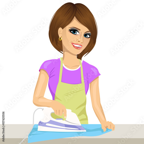 Happy young beautiful woman ironing clothes. Housework
