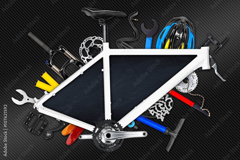 Fototapeta premium bicycle frame with empty blackboard and various bike parts / Fahrrad rahmen mit leerer Tafel und vielen verschiedenen Fahrradteilen