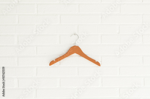 Orange wood children coat hanger photo