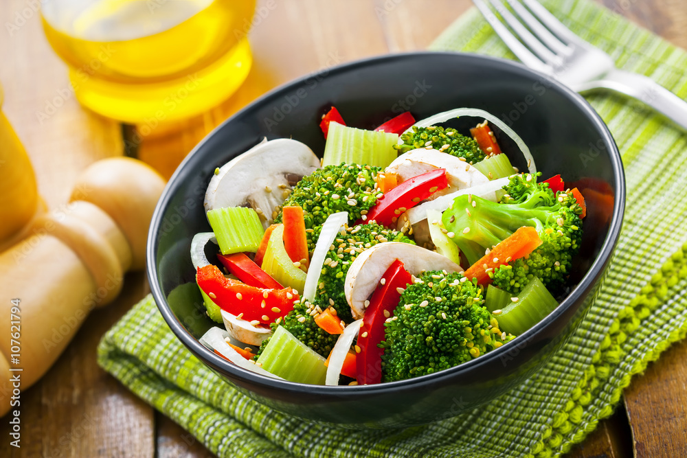 Healthy food made of broccoli, onion, mushroom, carrot and pepper. Vegetarian salad.