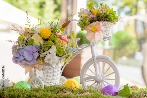 Bouquet of flowers on a decoratvie bicycle photo