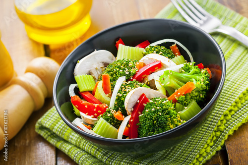 Healthy food made of broccoli, onion, mushroom, carrot and pepper. Vegetarian salad.