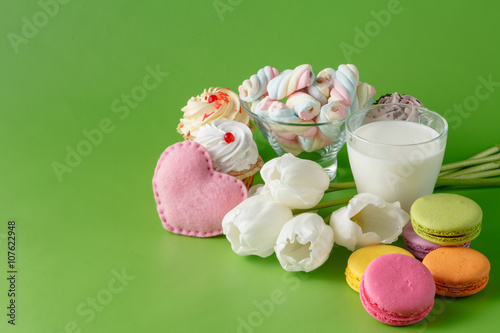 Kid breakfast with white tulips and sweets