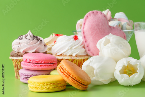Sweets on plain green background