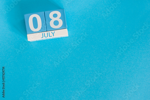 July 8th. Image of july 8 wooden color calendar on blue background. Summer day. Empty space for text