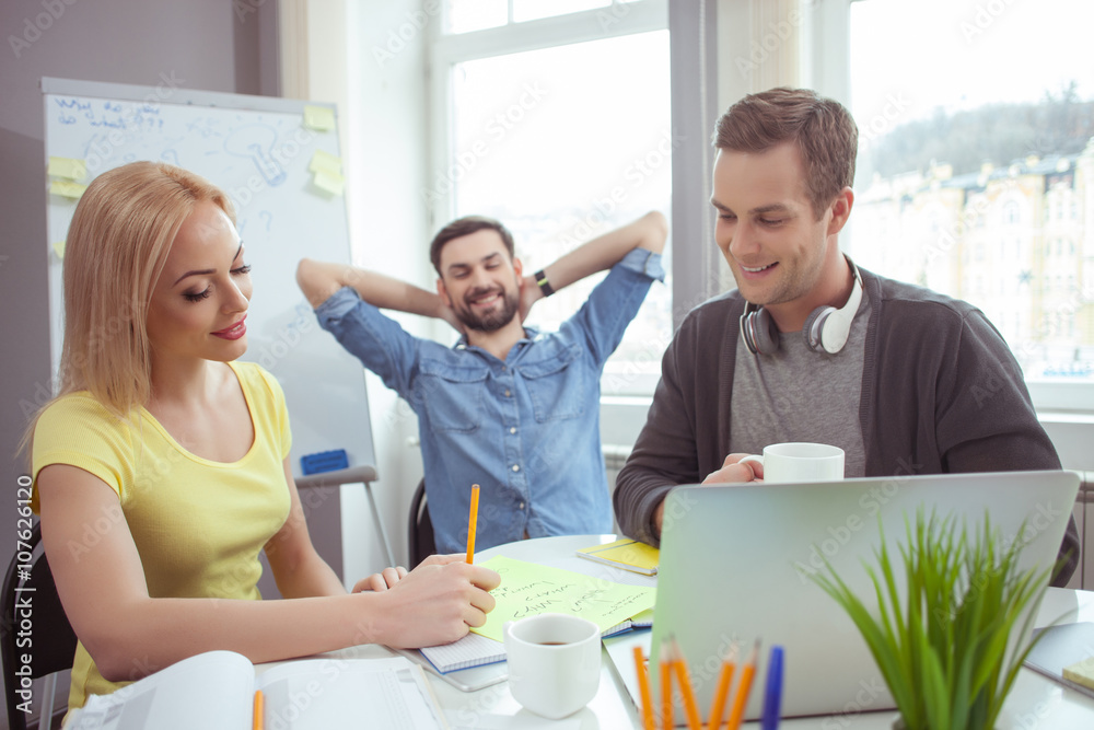 Cute friendly team is working in cooperation Cute friendly team is working in cooperation
