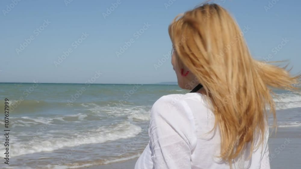 Caucasian blond girl enjoying the sun by the sea 1080p FullHD slow-mo footage - Blonde attractive woman outdoor slow motion 1920X1080 HD video Caucasian blond girl enjoying the sun by the sea 1080p FullHD slow-mo footage - Blonde attractive woman outdoor slow motion 1920X1080 HD video