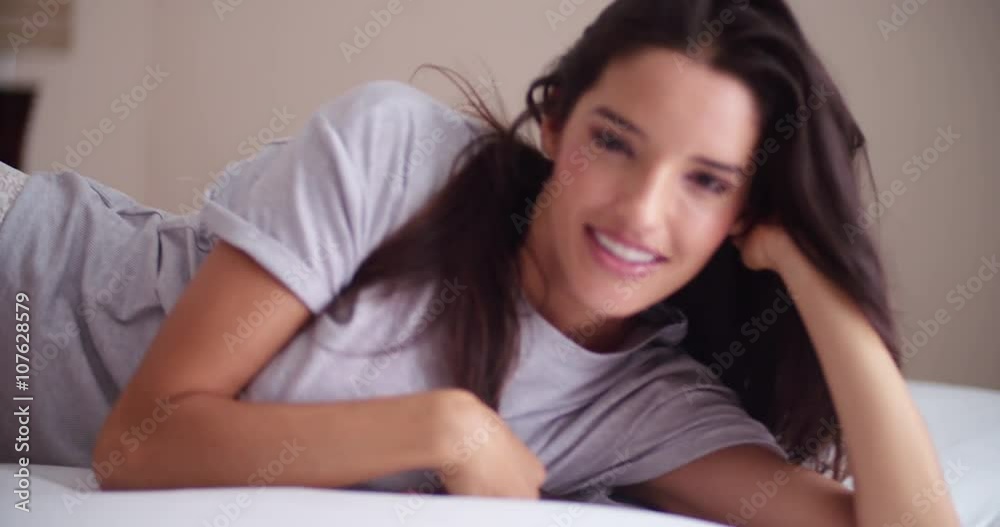 Seductive women looking at camera while smiling Seductive women looking at camera while smiling