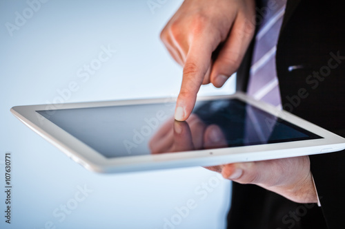 businessman using touchscreen on tablet