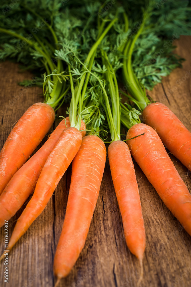 Carrots on a wooden background Carrots on a wooden background