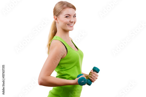 Woman exercising with dumbbells lifting weights
