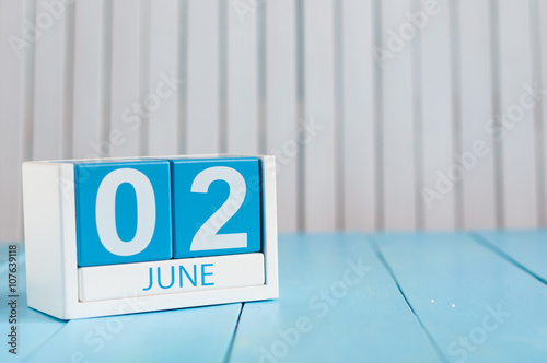 June 2nd. Image of june 2 wooden color calendar on white background.  Summer day, empty space for text photo