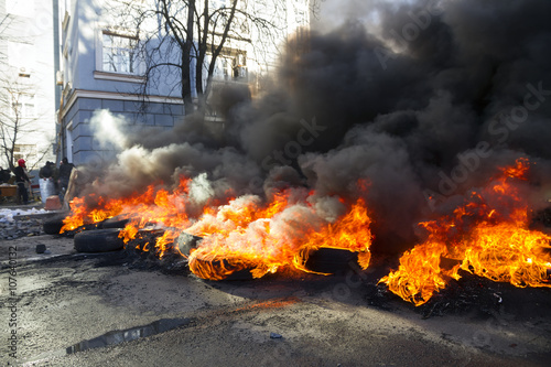 burning tires in the street Institutska photo