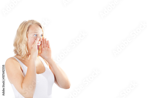 Young blonde woman screaming with copy space