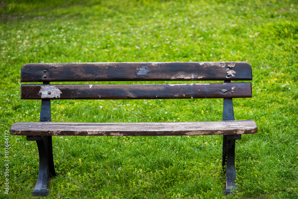 Old wooden bench in the spring park Old wooden bench in the spring park
