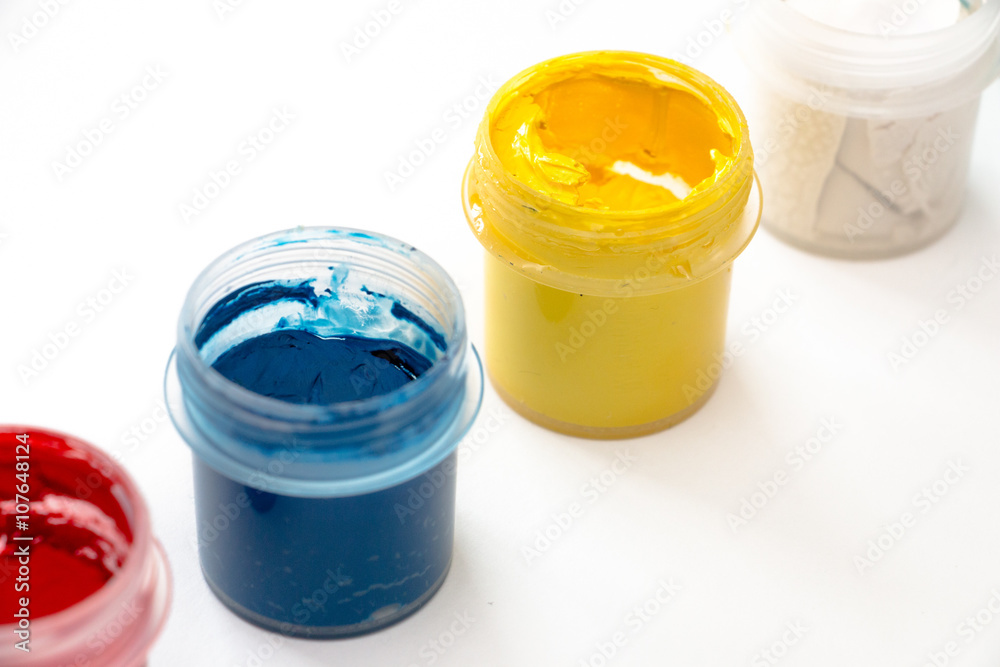 Gouache paint in jar isolated on white background.