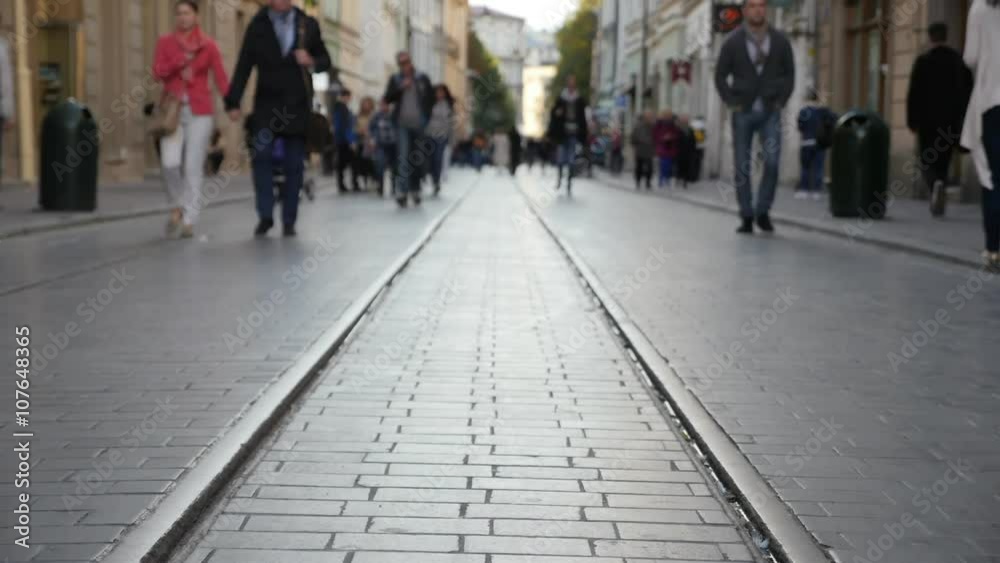 Peaople walking on the old pavement with old railroad. Timelaps
Peaople walking on the old pavement with old railroad. Timelaps