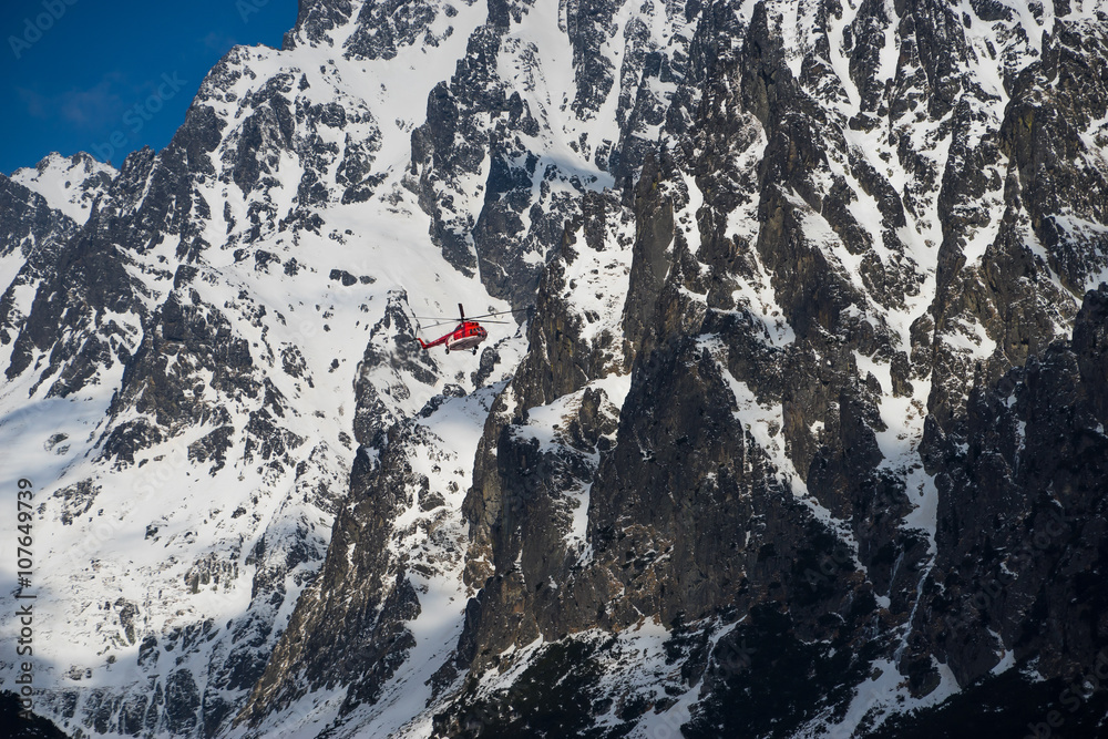 Winter mountains and helicopter