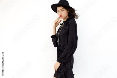 In hat and dress