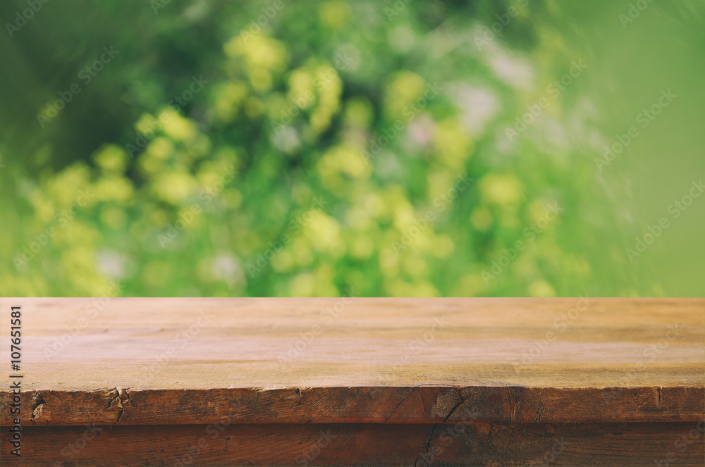 front rustic wood boards and abstract forest background. vintage filtered and toned
front rustic wood boards and abstract forest background. vintage filtered and toned