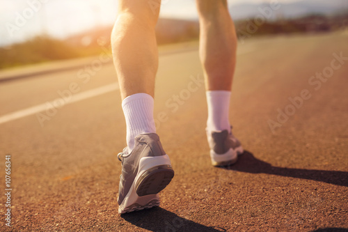 Running sport shoes on runner. Legs and running shoe closeup of