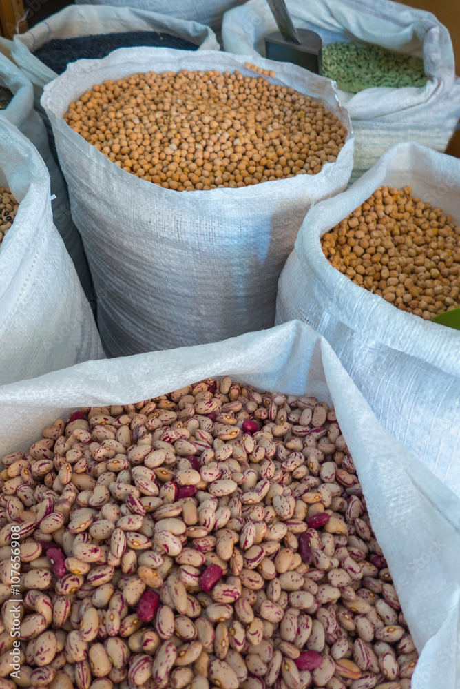 Obraz premium Variety of legumes in white bags