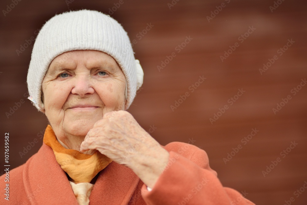 Senior woman smiling and dreaming in garden. Senior woman smiling and dreaming in garden.