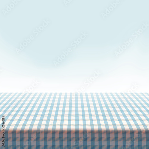 Vector picnic table covered with tablecloth on blue background.
