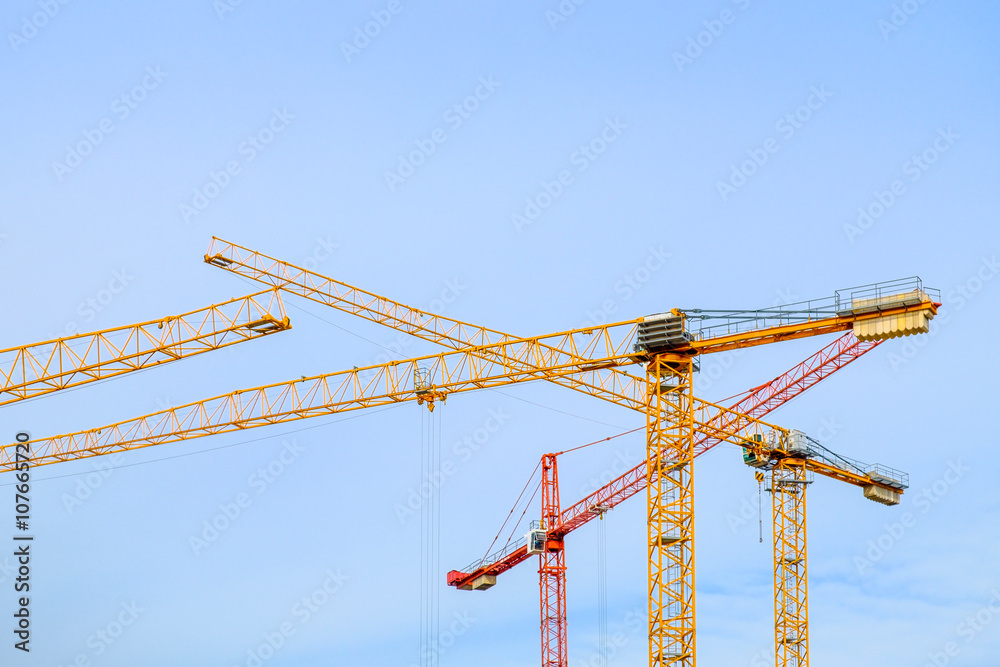 Industrial image of construction cranes with sky background Industrial image of construction cranes with sky background