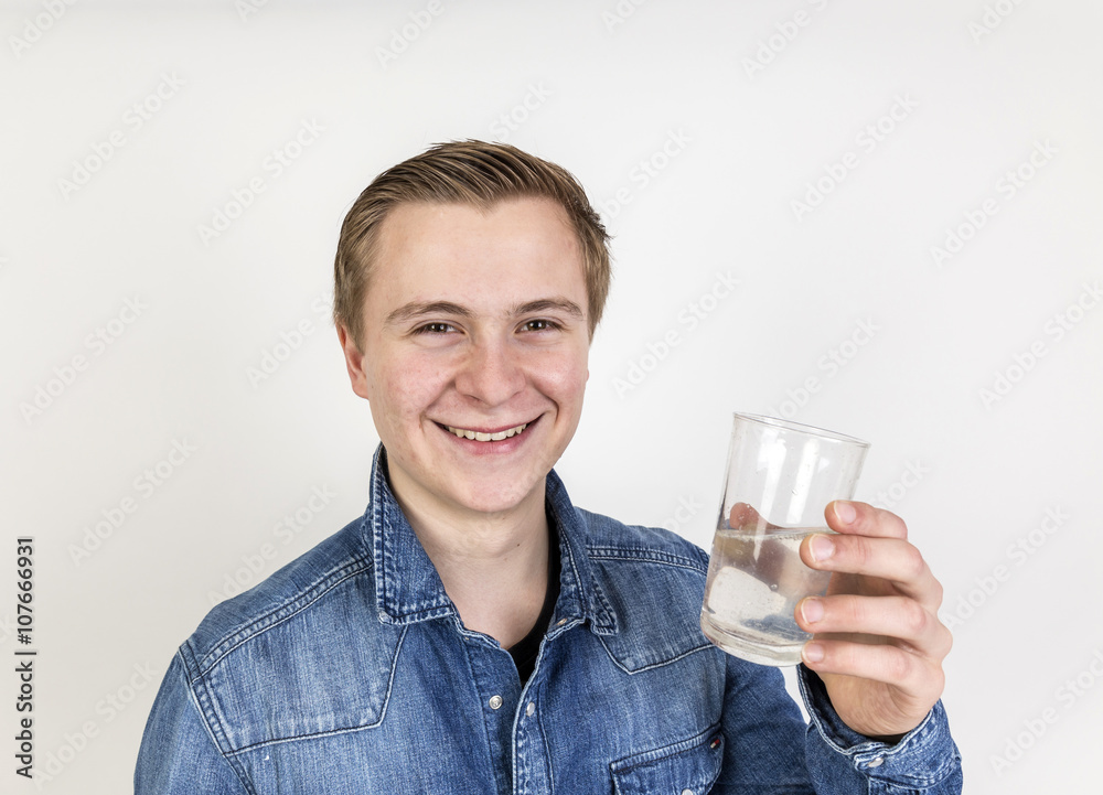 portrait of cute teenage boy drinking water portrait of cute teenage boy drinking water