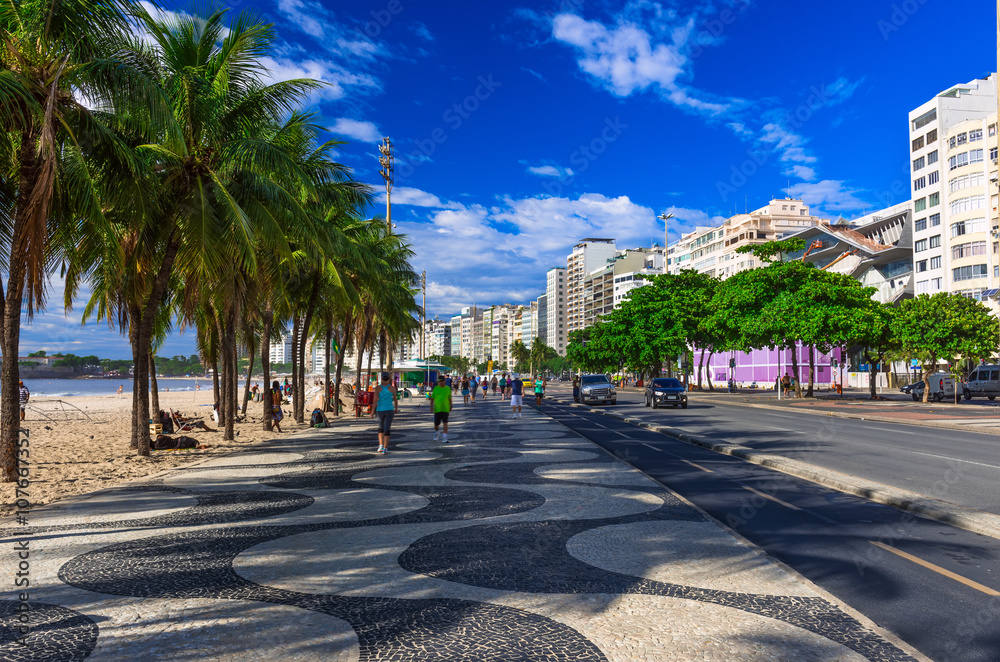 Copacabana with palms and mosaic of sidewalk in Rio de Janeiro. Brazil Copacabana with palms and mosaic of sidewalk in Rio de Janeiro. Brazil