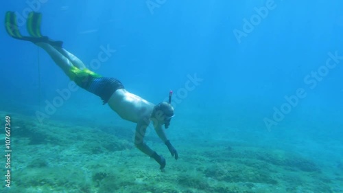 Wallpaper Mural Underwater shot how diver approach to giant red starfish lying on the seabed in the natural environment.
 Torontodigital.ca