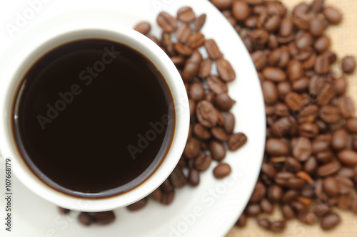 cup of coffee with roasted coffee