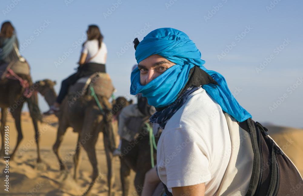 Rider tourist on camels caravan, Morocco