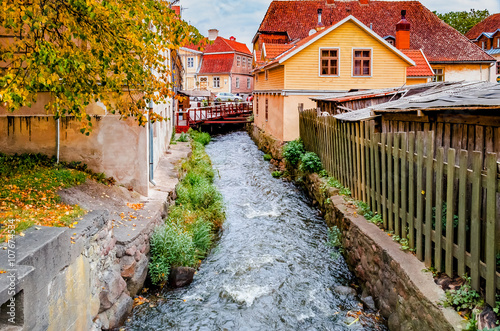 Rapid brook in old center of Kuldiga city, Latvia, Europe