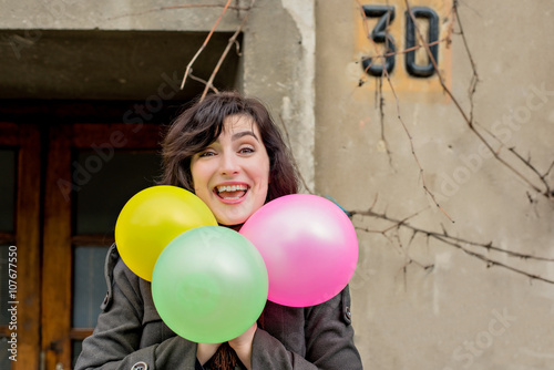I'm 30! Girl laughing with red balloons