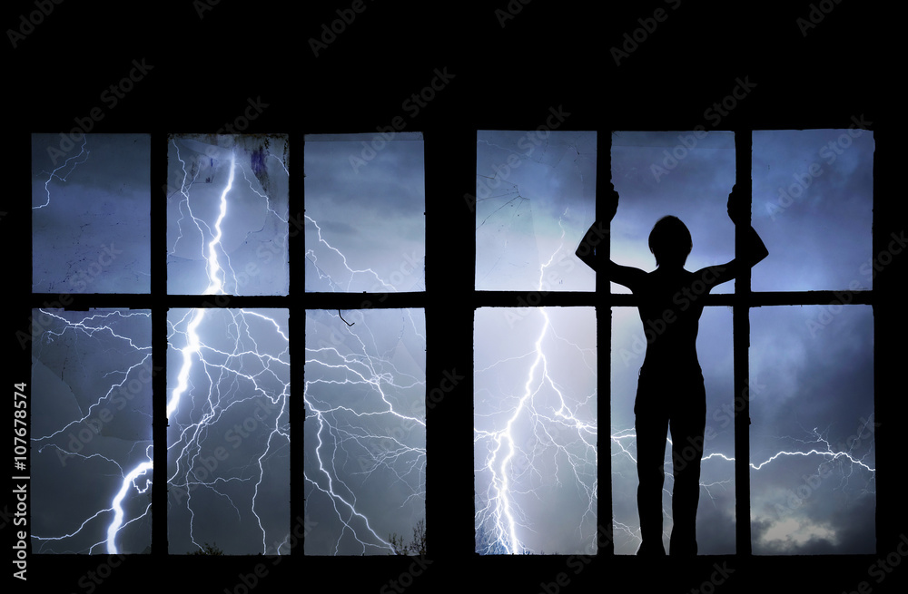 Fototapeta premium Silhouette of man watching lightning, thunder, rain and storm th