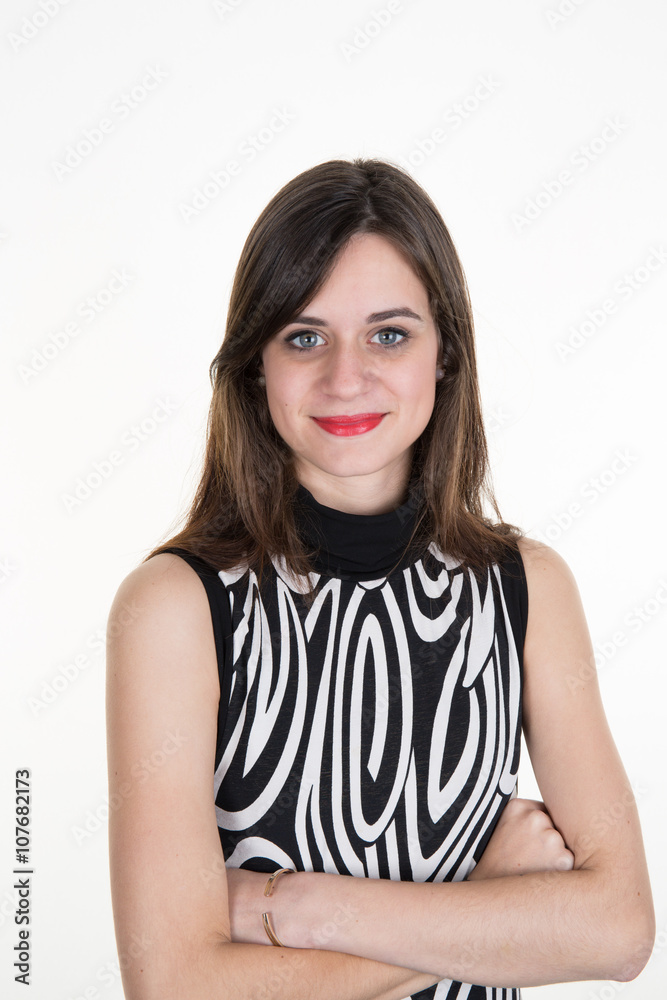 Beautiful young woman standing with arms crossed over white background Beautiful young woman standing with arms crossed over white background