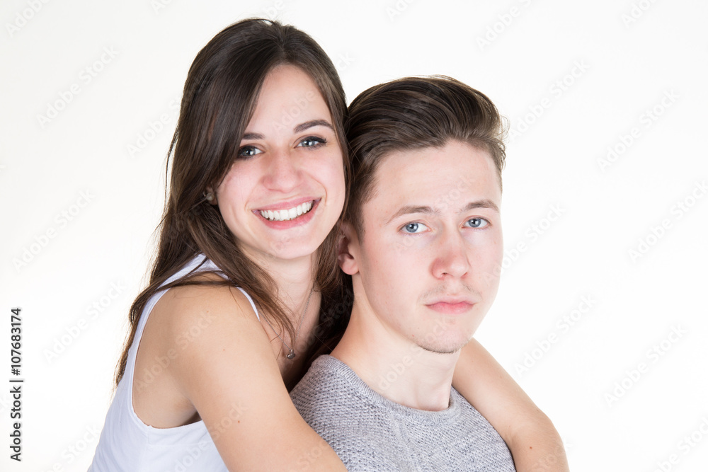 Young man and woman together over white background Young man and woman together over white background