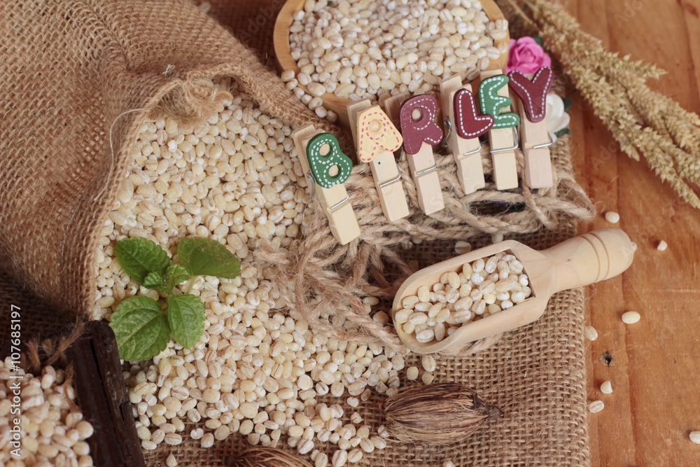 Fototapeta premium raw the barley on wood background.
