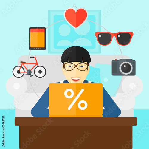 Man shopping online using his laptop.