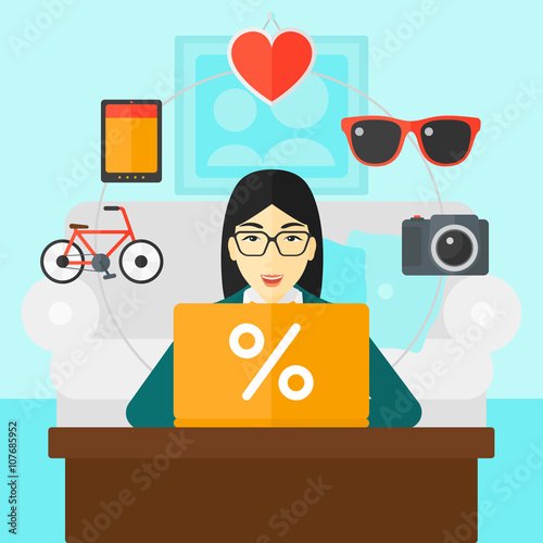 Woman shopping online using her laptop.