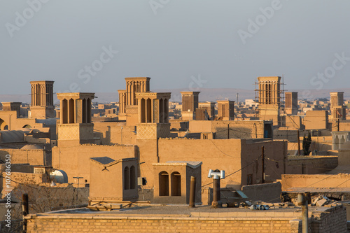 Badgirs, he windcatchers on the roof of an old house in Yazd, Iran photo