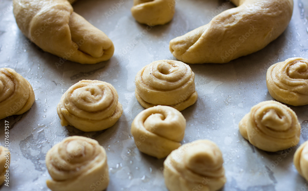 Raw pieces of buns dough before fermentation Raw pieces of buns dough before fermentation