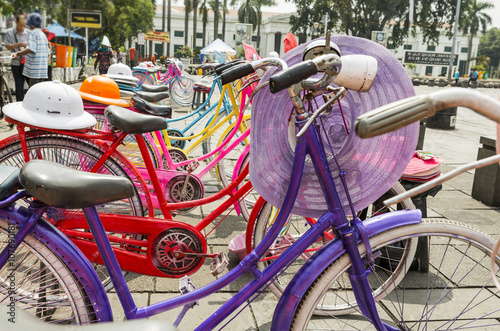 Colorful bicycles lined up for hire in Fatahilah Square in Jakarta's Old Town. Bicycling is popular among the visiting locals and tourists alike. photo