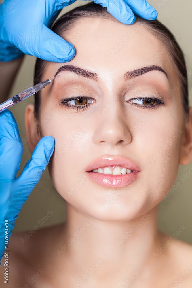 Beauty woman giving medical injections. Cosmetology. Beauty Face