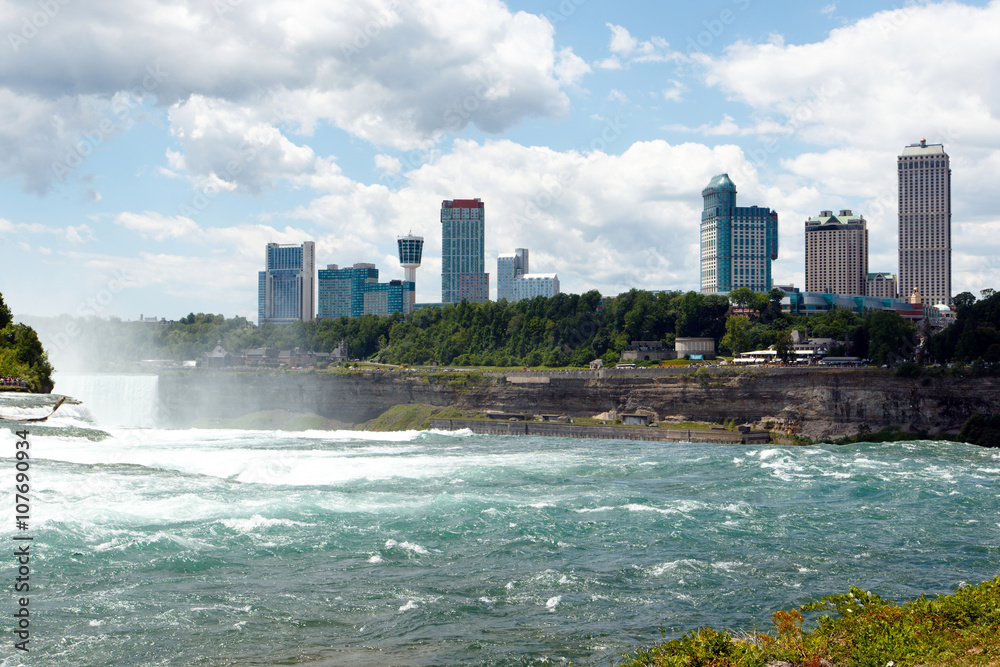 Color DSLR stock wide angle image of Niagara Falls, showing American Falls and Canadian side, with casino and hotels; horizontal with copy space for text
