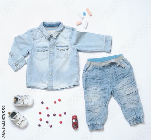 top view trendy denim look of baby boy clothes with toy and snea