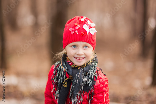 portrait of a smiling girl in a spring day for a walk in the woods
