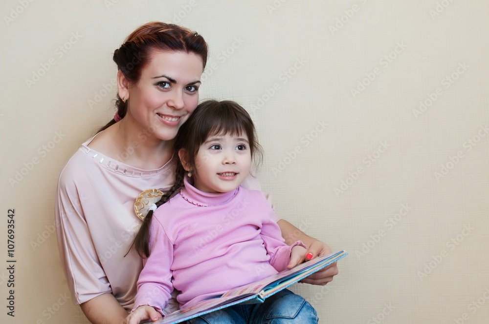 mother and daughter at home reading a book, education, and love mother and daughter at home reading a book, education, and love